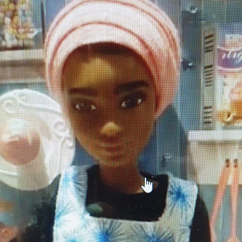 The Nadiya doll was wearing her own version of Blisshome's Make Life Colourful aprons.