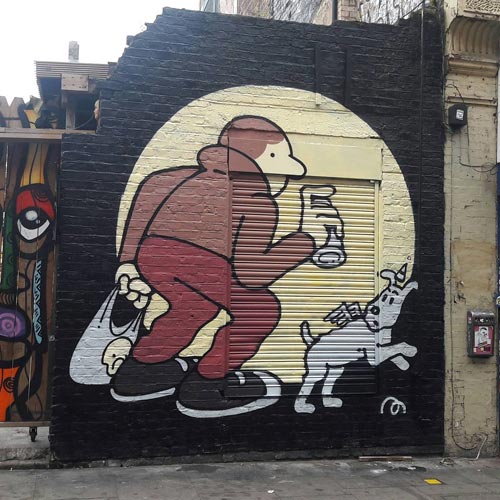 Tintin and his dog, Snowy were spotted in Brick Lane touting a spray can.