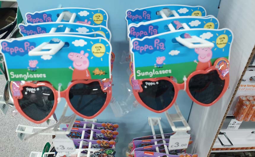 Peppa Pig sunglasses were on clip strips near Wilko's suncare products.