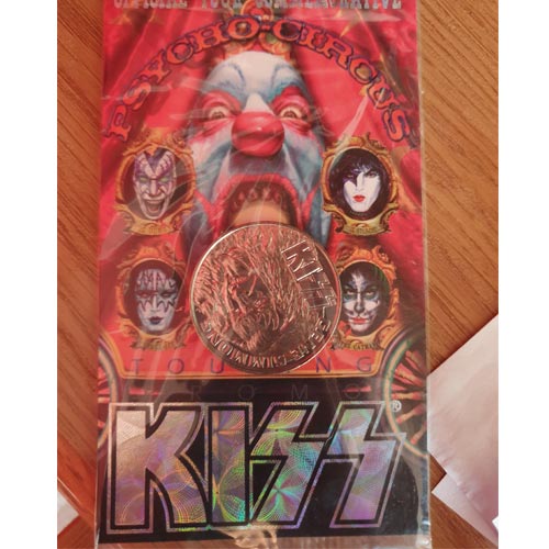 A KISS trading card and coin is part of Ian's Museum of Licensing.