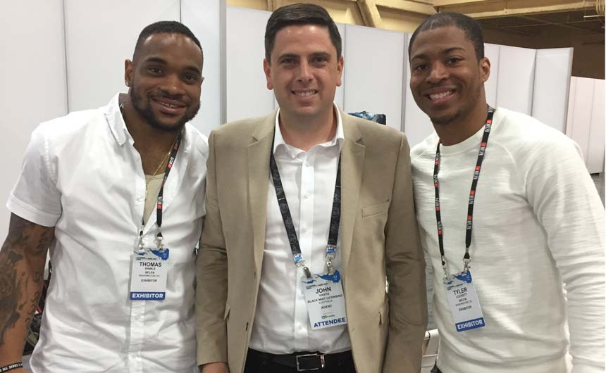 John pictured with Seattle Seahawks team members at the NFLPA stand at Licensing Expo.