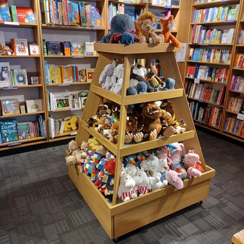 There is a dedicated display for plush toys in the children's book area.