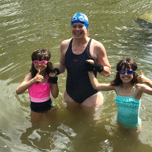 Katie with her nine year old twins enjoying the river Frome at Farleigh Hungerford – the oldest open water swimming club in the country.